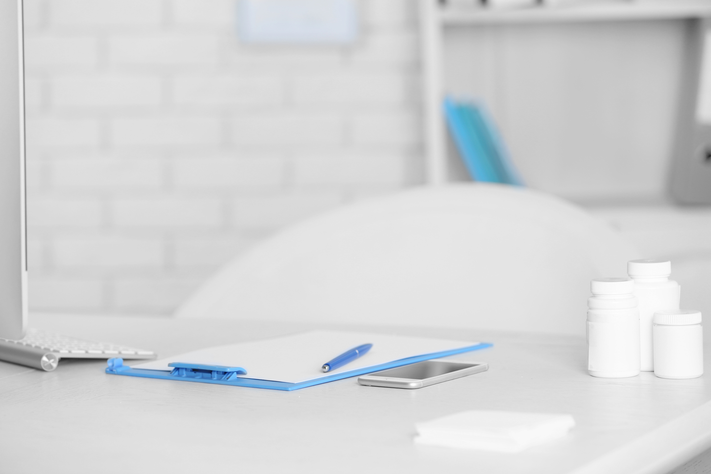 Doctor's Workplace with Clipboard and Pills